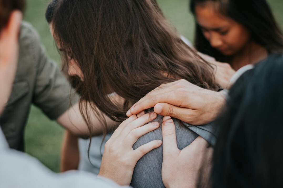 group of people supporting each other