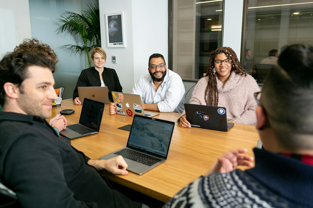 people discussing in a meeting