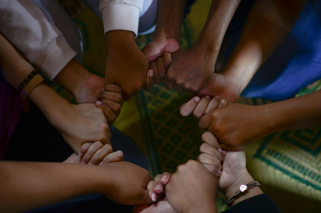 people standing together in unity