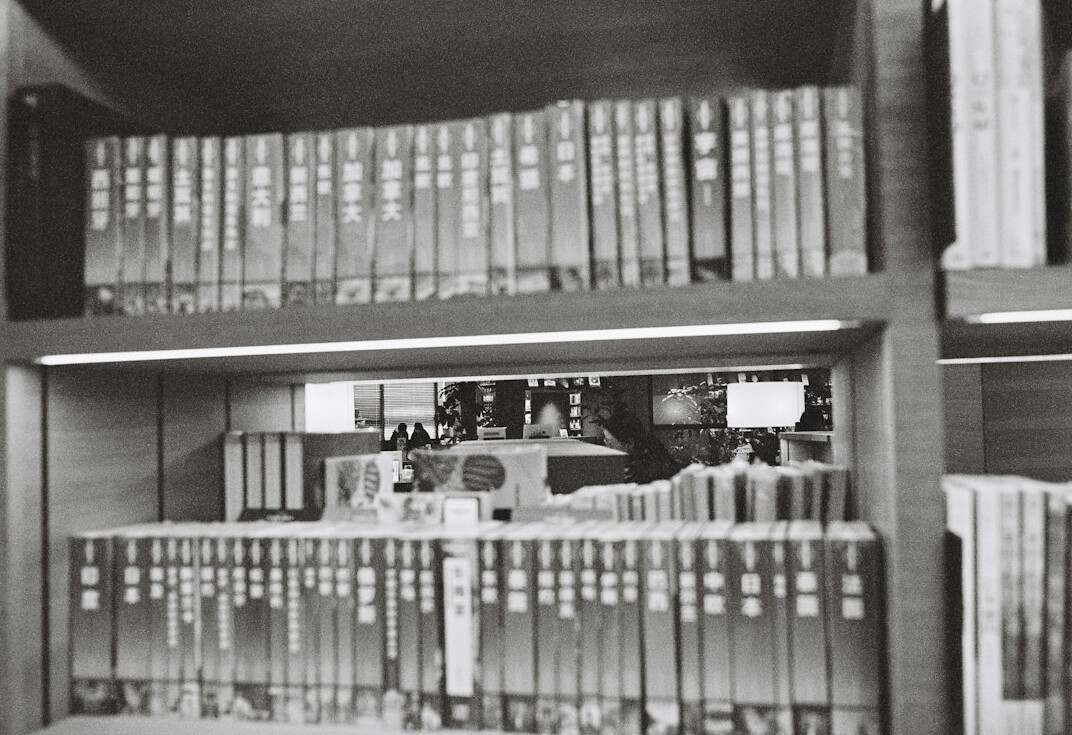 Archive shelves with ordered paper folders and research files