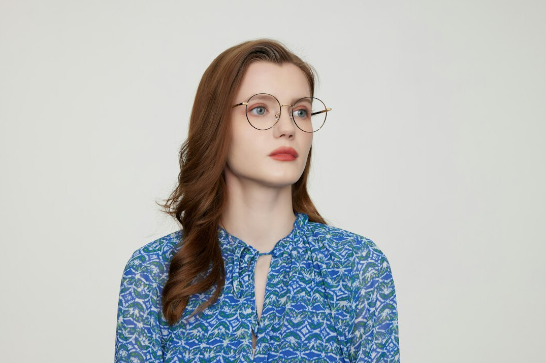 Studio portrait of a middle-aged woman researcher with glasses